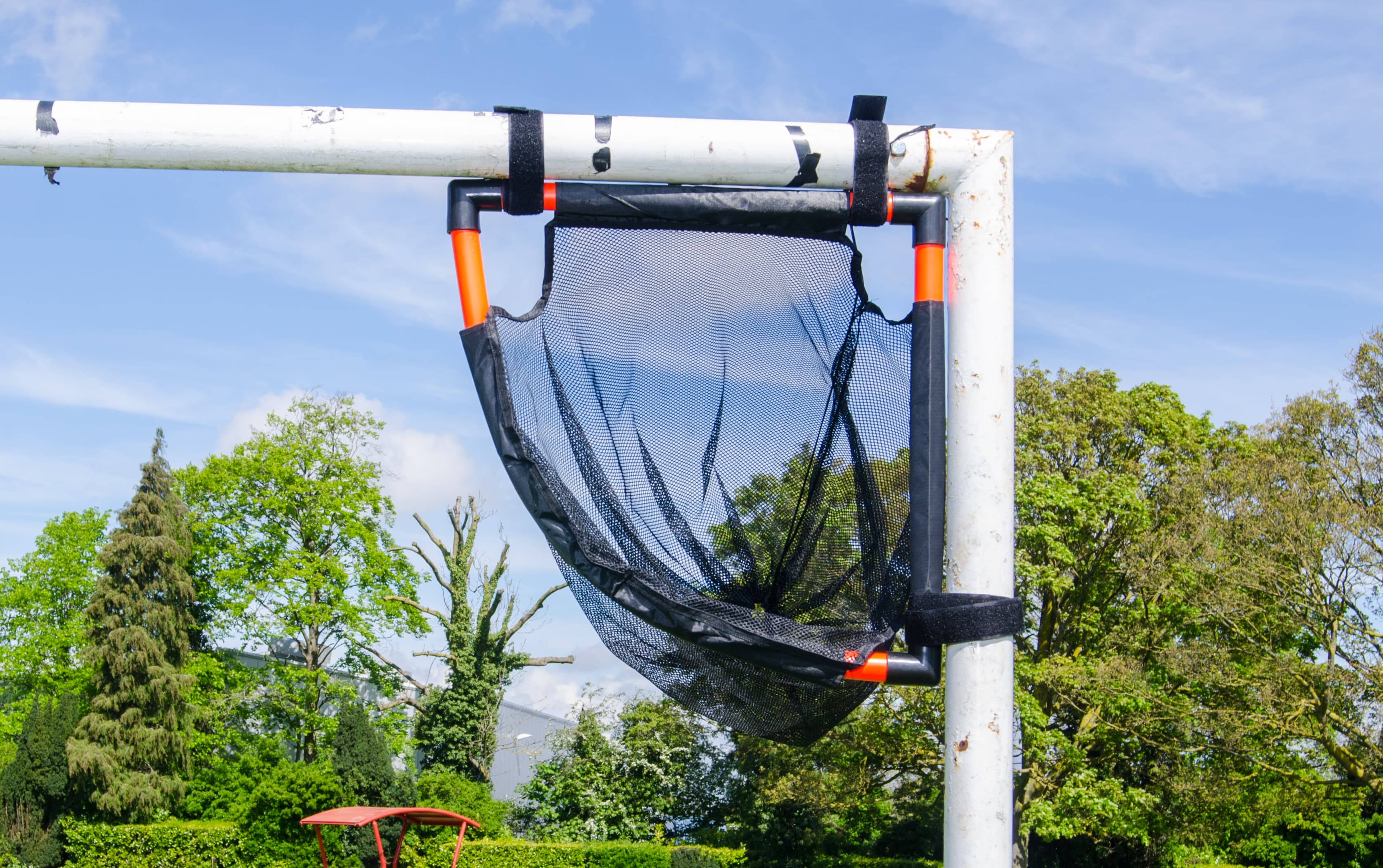 Player striking the ball towards a TopCorner target in the upper goal corner